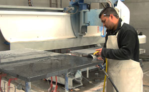 Hand finishing a granite worktop Hand finishing a granite worktop